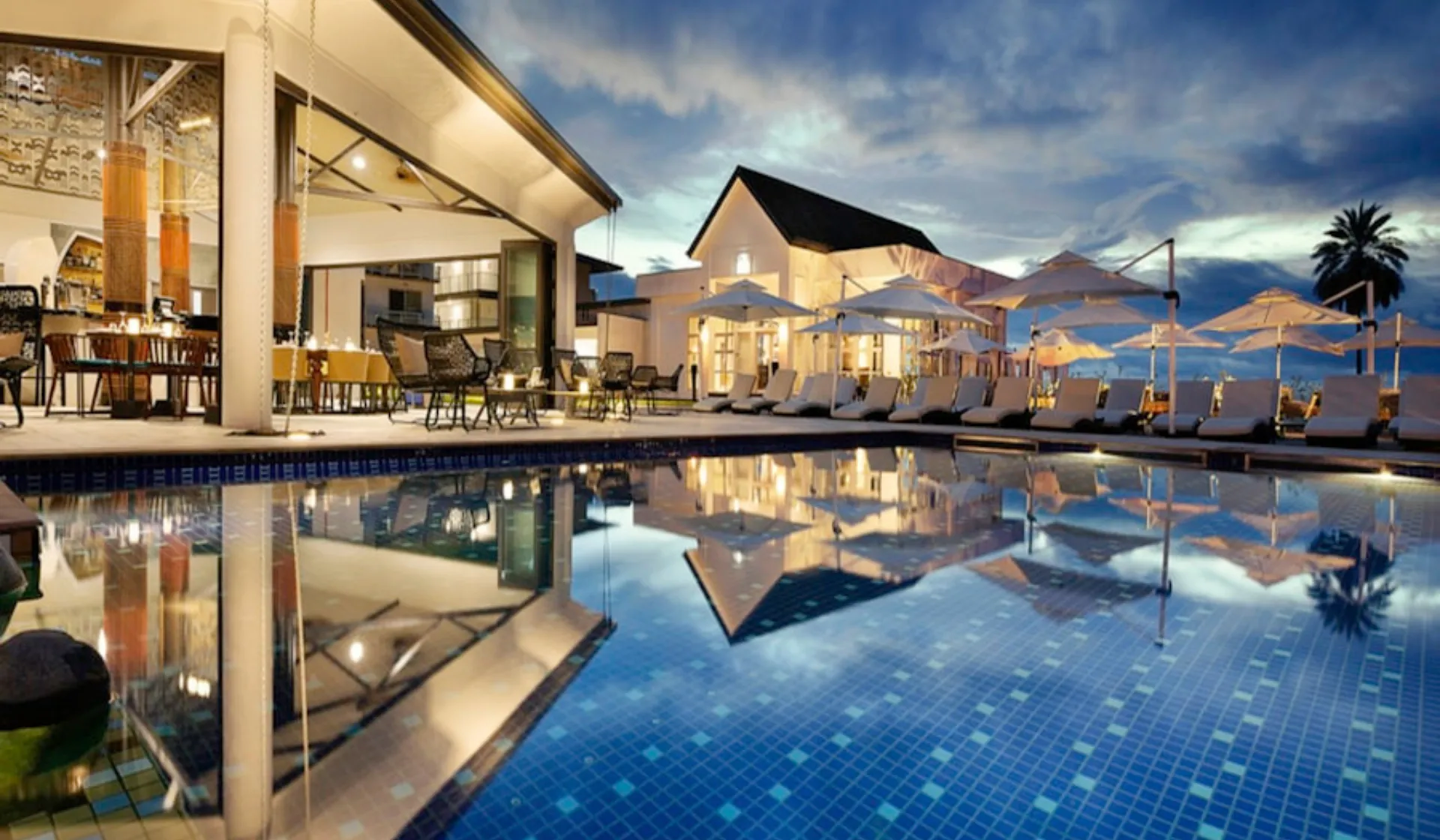 Luxury pool and outdoor living area in a Naples Florida residence with lush tropical landscaping, representing the premium pool projects that LeadGulls full-stack marketing services help Naples pool companies attract